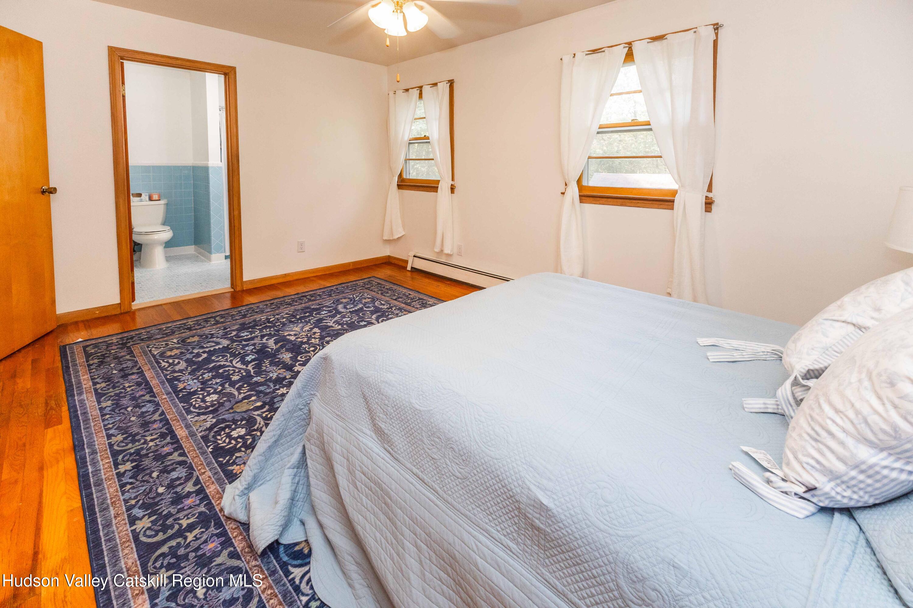 94 Lodge Road Saugerties, NY 12477 - Photo 27 of 46 a bedroom with a bed and a window