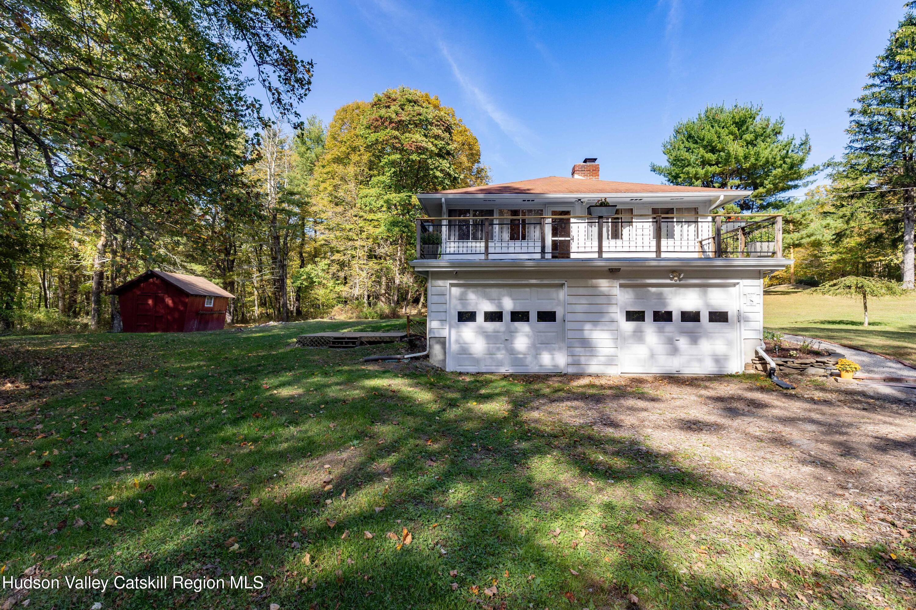94 Lodge Road Saugerties, NY 12477 - Photo 3 of 47 a front view of a house with a garden