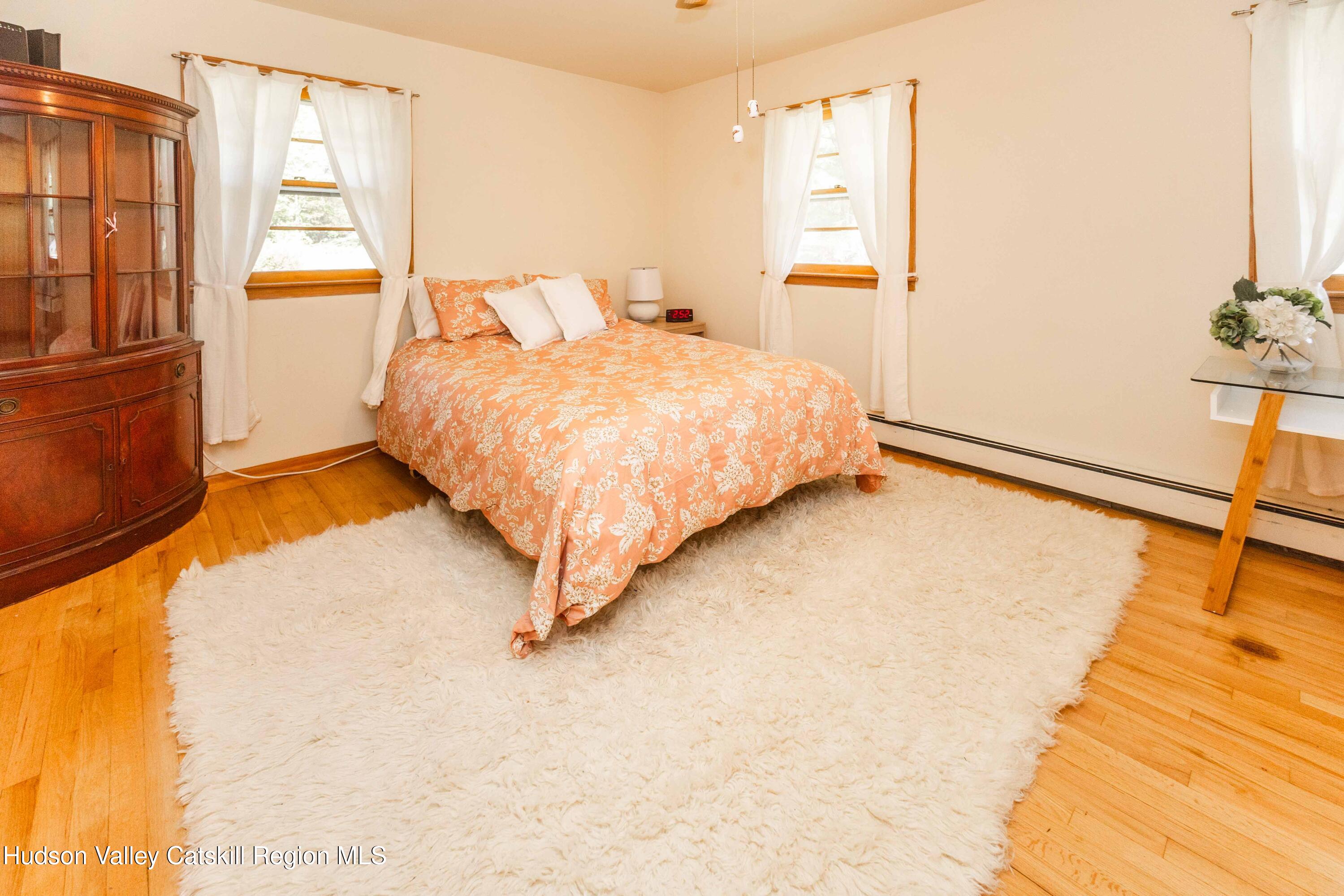 94 Lodge Road Saugerties, NY 12477 - Photo 31 of 47 a bedroom with a bed and a window