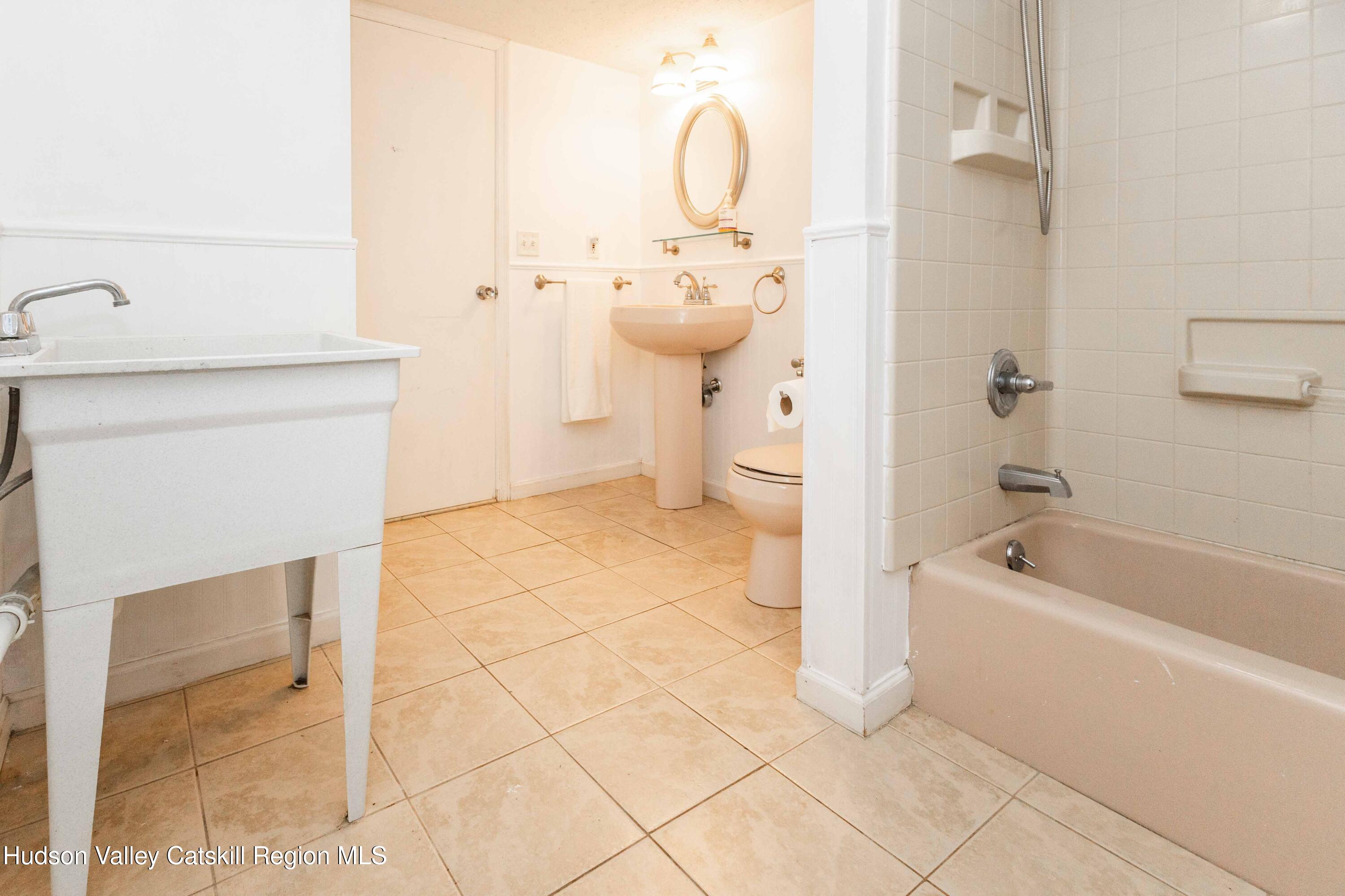 94 Lodge Road Saugerties, NY 12477 - Photo 42 of 47 a bathroom with a sink a toilet and shower