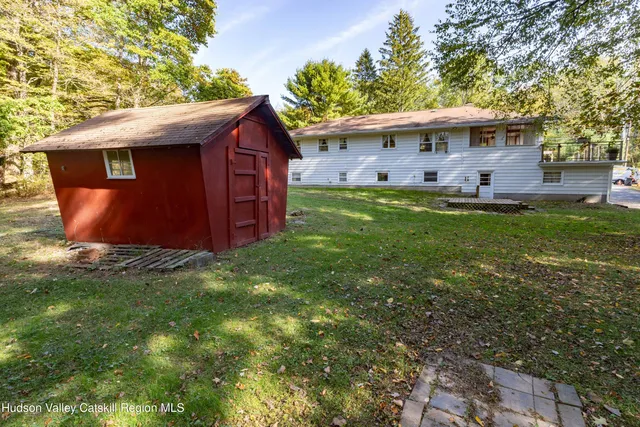 a living room with a couch and a rug