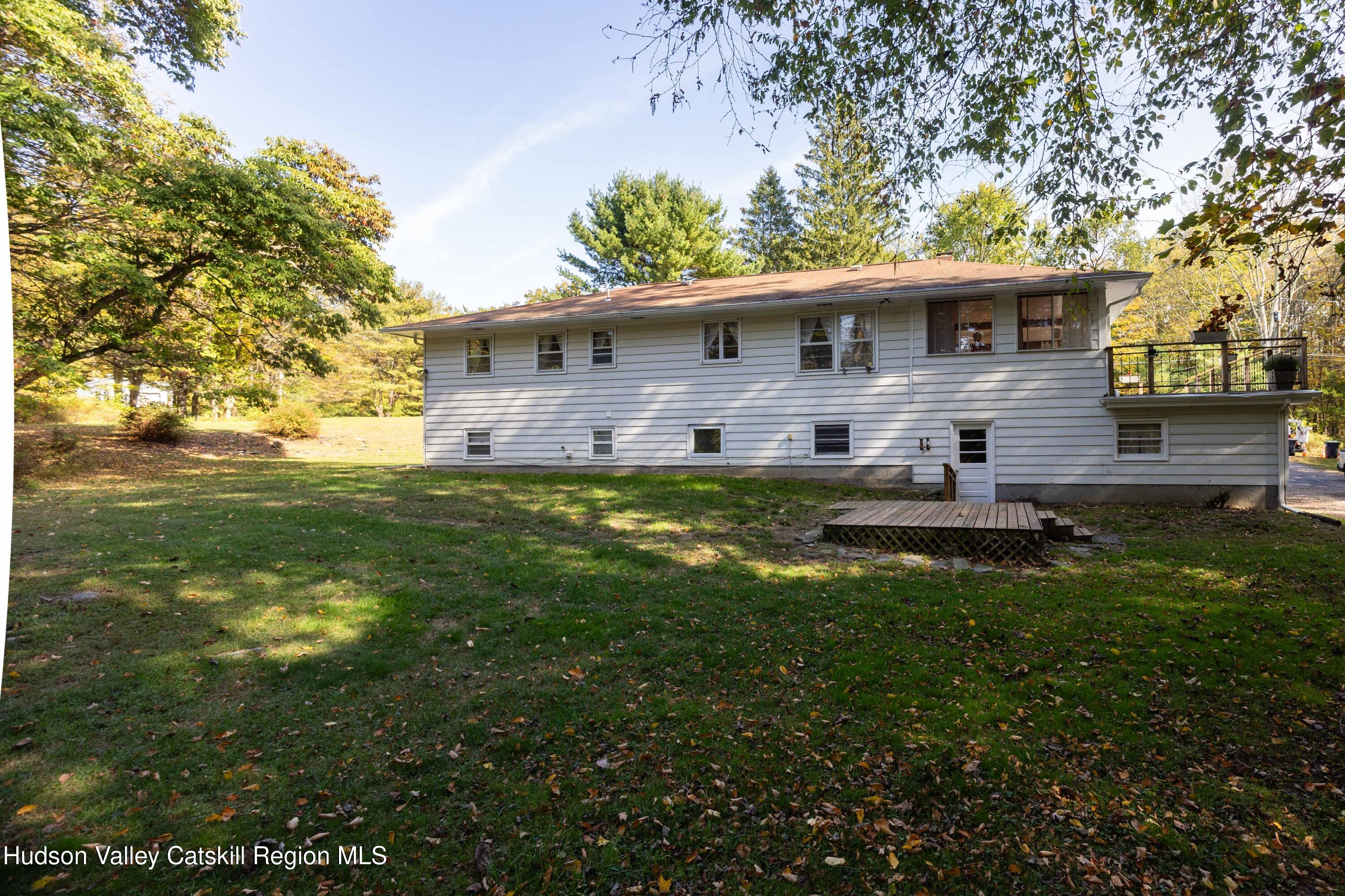 94 Lodge Road Saugerties, NY 12477 - Photo 10 of 47 a backyard of a house with lots of green space