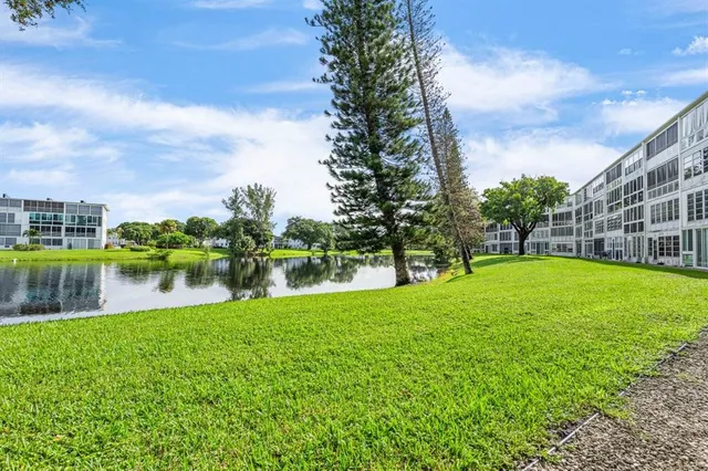 a view of lake with houses in the back