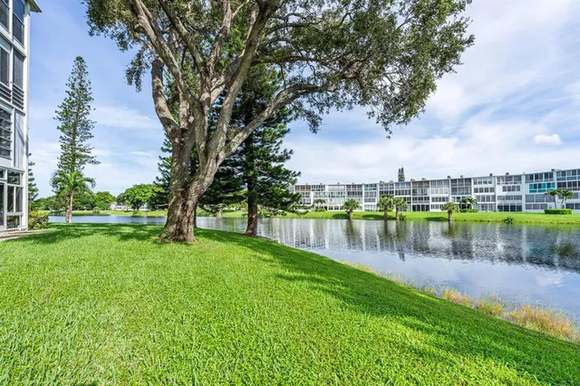 a view of a lake with a house in the background