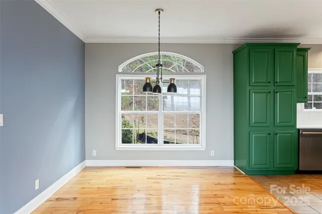 a view of empty room with window and entryway