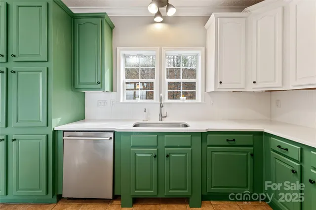 a kitchen with a sink cabinets and a window