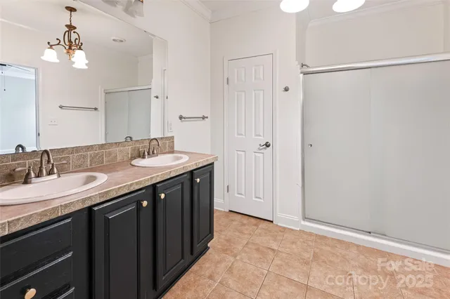 a bathroom with a double vanity sink and a mirror