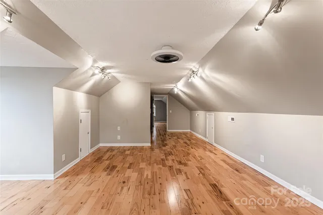 a view of a town with mountains in the background