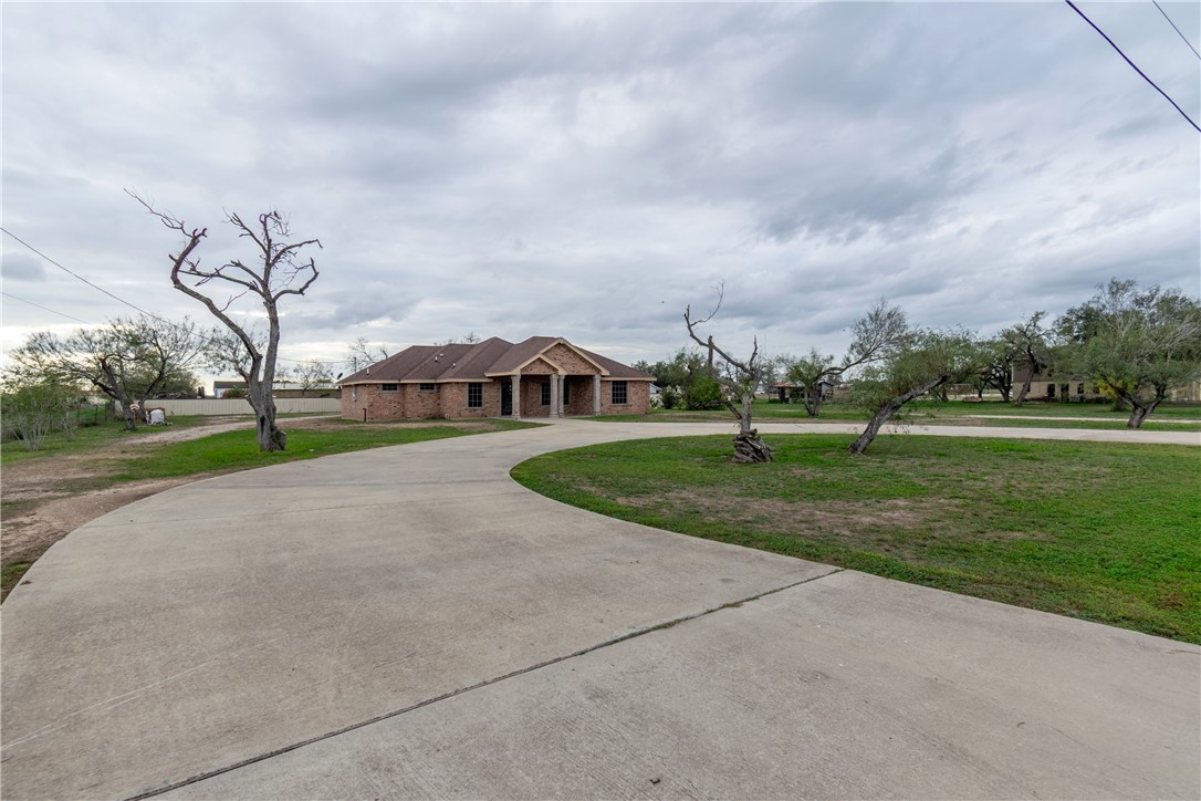204 County Road 1331 Alice, TX 78332 - Photo 25 of 30 a view of street with houses in the background