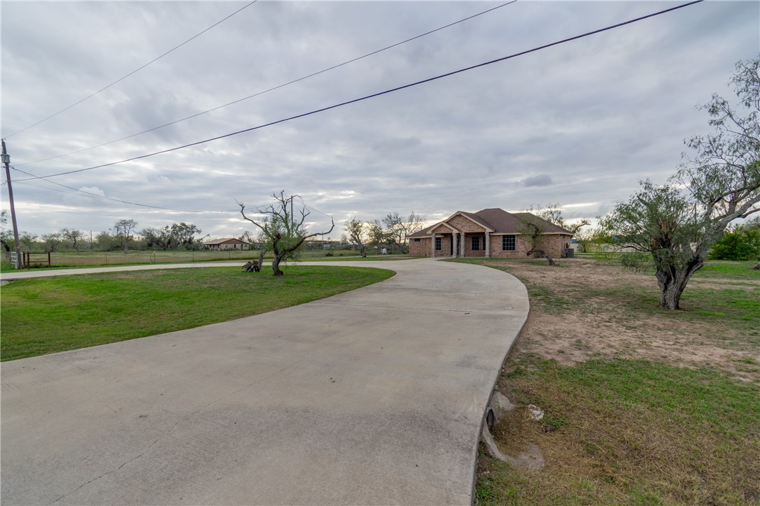 204 County Road 1331 Alice, TX 78332 - Photo 26 of 30 a view of a house with a big yard