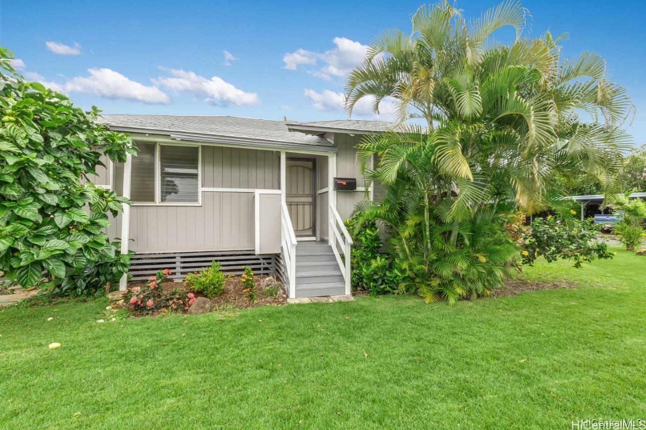 2963 Koali Road, Unit C Honolulu, HI 96826 - Photo 1 of 1 a front view of a house with a garden