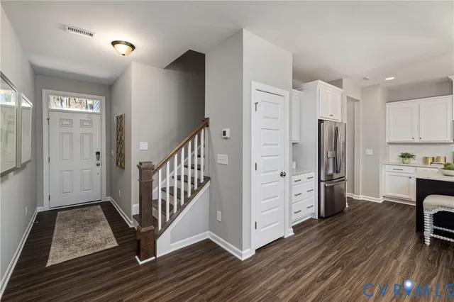 a view of kitchen with furniture and wooden floor