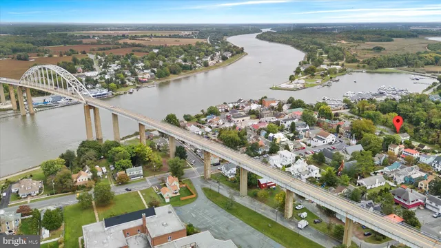 a living room with fireplace furniture and a window