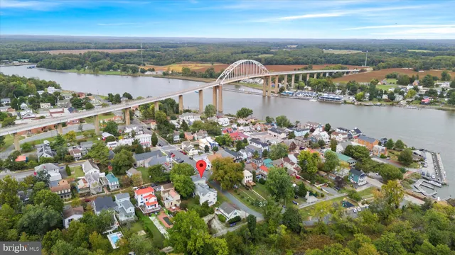 a bathroom with a toilet sink vanity and mirror