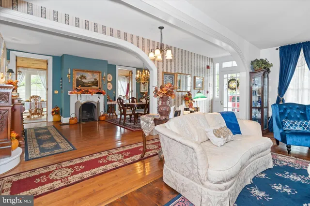 a kitchen with stainless steel appliances granite countertop a refrigerator stove and white cabinets