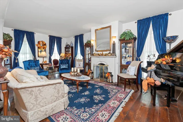 a bathroom with a sink a toilet and shower curtain