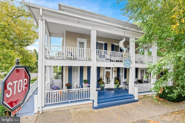 a view of a house with a yard and plants