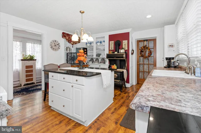 a living room with furniture a rug and a chandelier