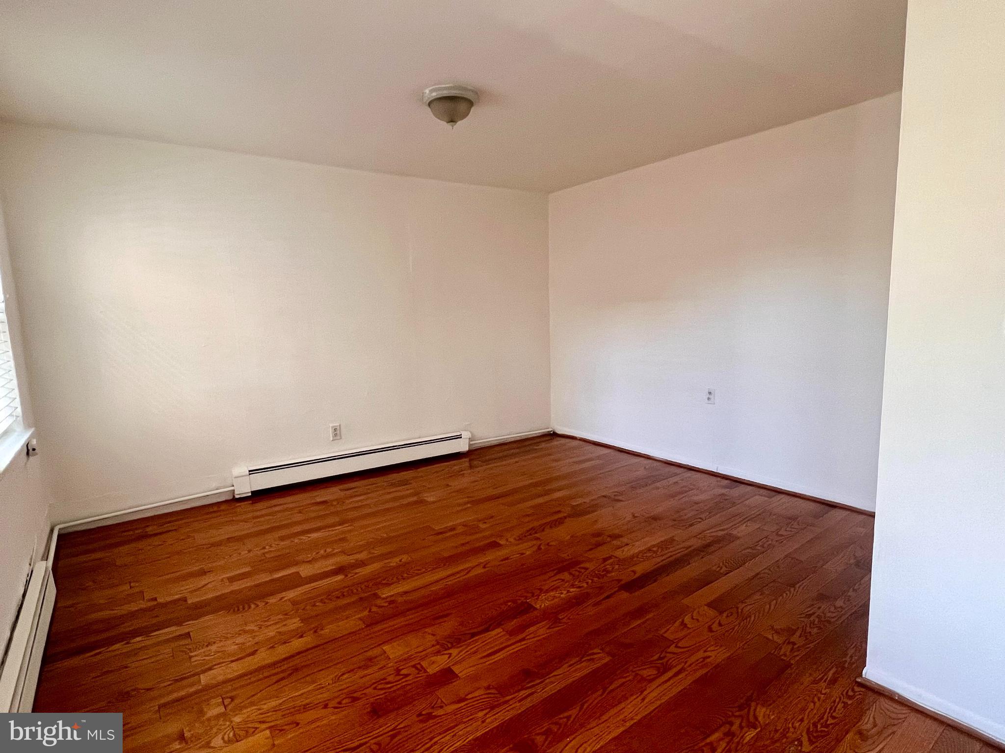 1247 Shackamaxon Street, Unit 2R Philadelphia, PA 19125 - Photo 4 of 12 a view of empty room with wooden floor