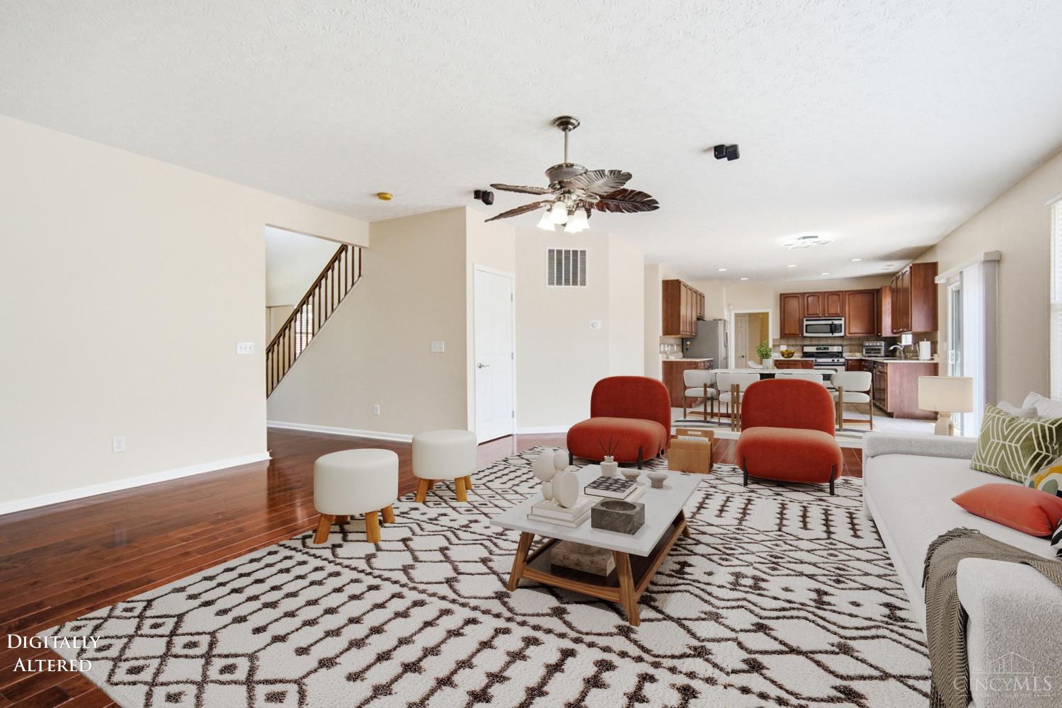 4431 Springfield Lane Mason, OH 45040 - Photo 14 of 52 Expansive living room featuring beautiful hardwood floors and a cozy fireplace