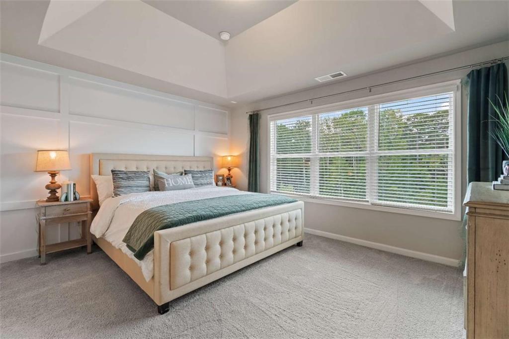 35 Cobalt Lane Newnan, GA 30265 - Photo 12 of 19 a bed sitting in a spacious bedroom next to a window