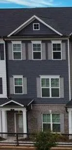 a front view of a house with parking