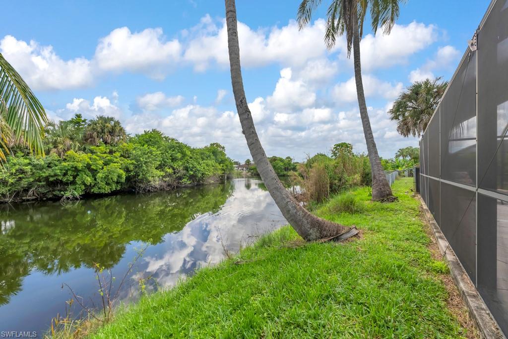 4736 25th Avenue Southwest Naples, FL 34116 - Photo 18 of 26 a view of a garden with a lake