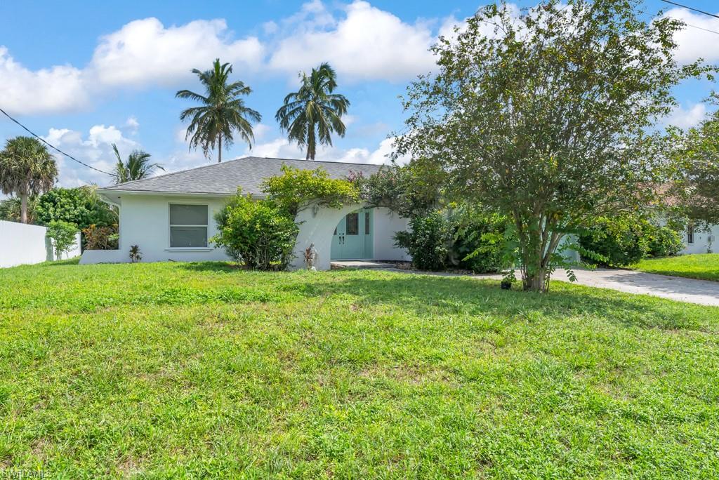 4736 25th Avenue Southwest Naples, FL 34116 - Photo 20 of 26 a front view of house with yard and green space