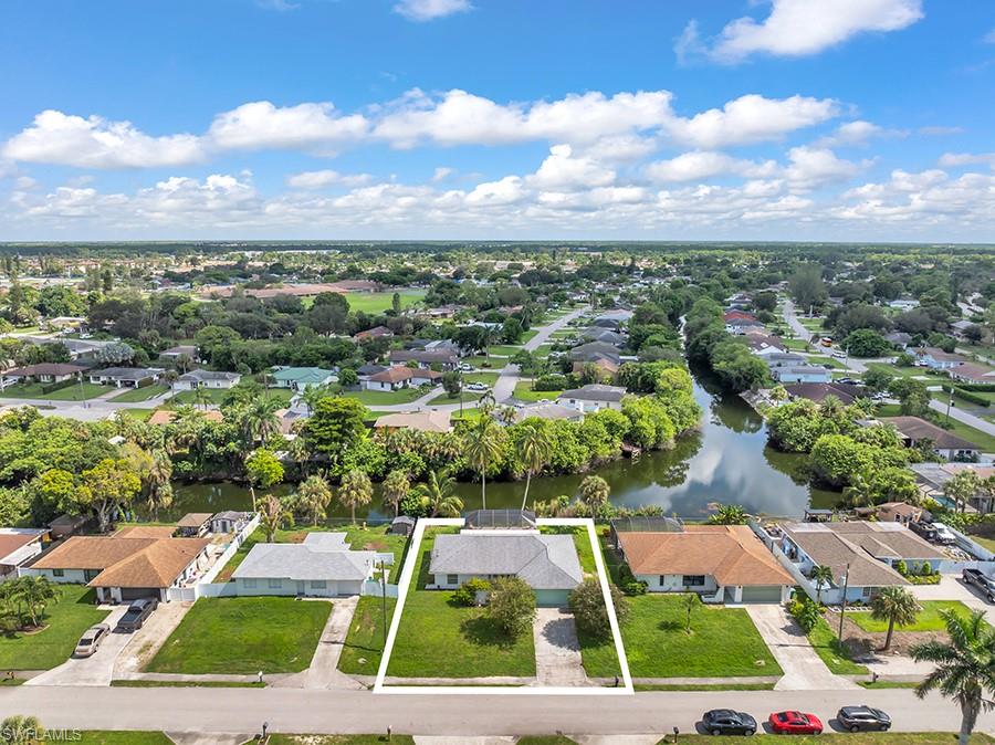 4736 25th Avenue Southwest Naples, FL 34116 - Photo 24 of 26 an aerial view of houses with a yard