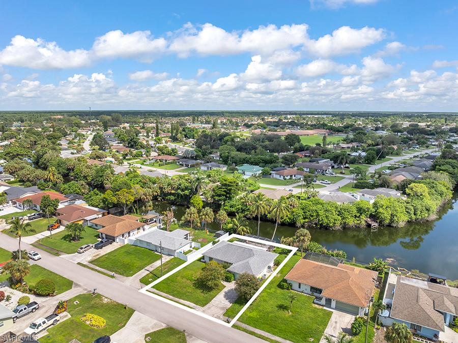 4736 25th Avenue Southwest Naples, FL 34116 - Photo 25 of 26 an aerial view of residential houses with outdoor space and lake view