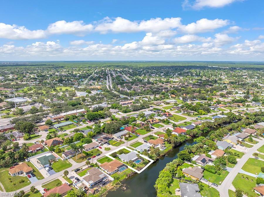 4736 25th Avenue Southwest Naples, FL 34116 - Photo 26 of 26 an aerial view of residential building and lake