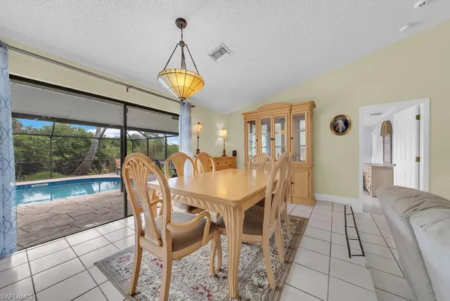 a kitchen with stainless steel appliances a refrigerator sink and stove