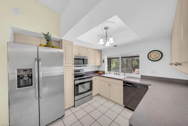 a bed room with a bed and a chair