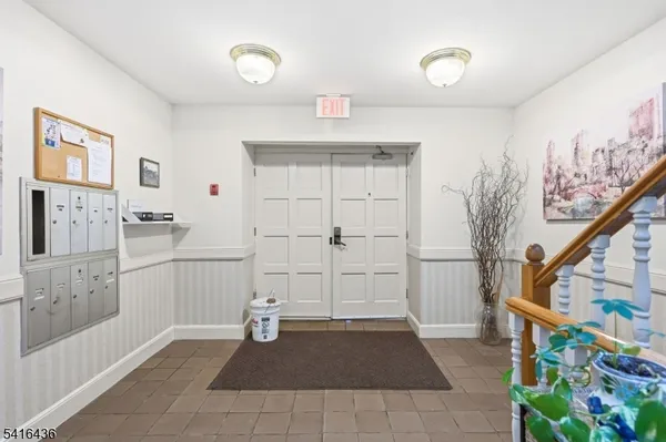 a view of a hallway with workspace