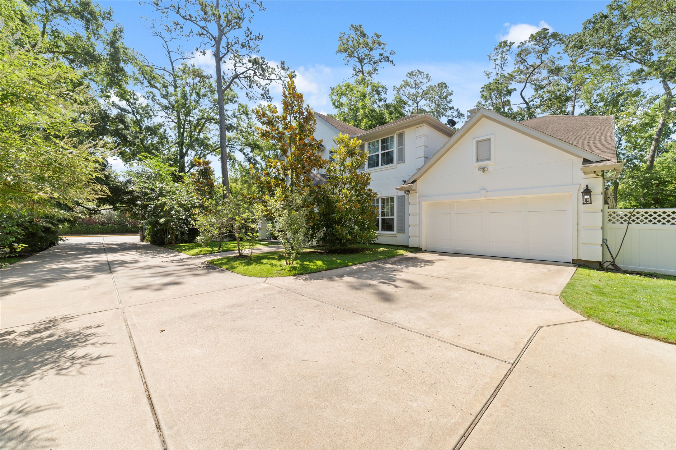 335 Voss Road Houston, TX 77024 - Photo 2 of 45 a view of a house with a yard and garage