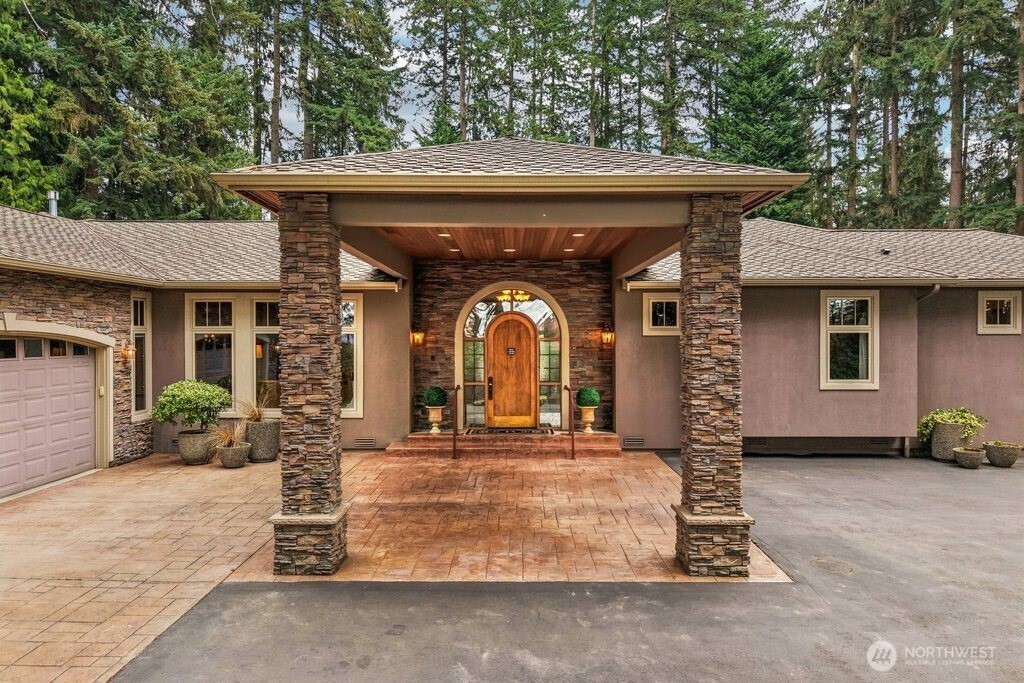 21611 45th Avenue Southeast Bothell, WA 98021 - Photo 3 of 40 a front view of a house with garden