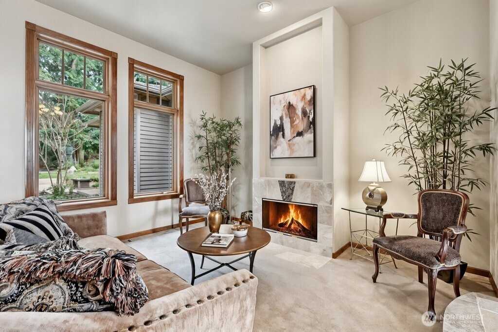 21611 45th Avenue Southeast Bothell, WA 98021 - Photo 5 of 40 a living room with furniture and a fireplace