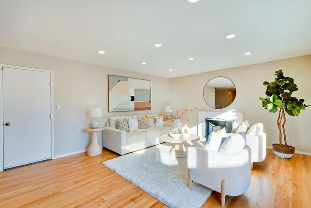 a bedroom with furniture and a potted plant