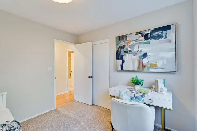 a bedroom with bed and a window