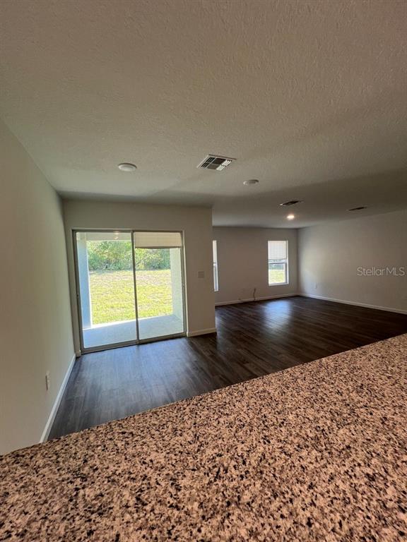 9131 Swiss Road Spring Hill, FL 34606 - Photo 6 of 16 a view of empty room with window