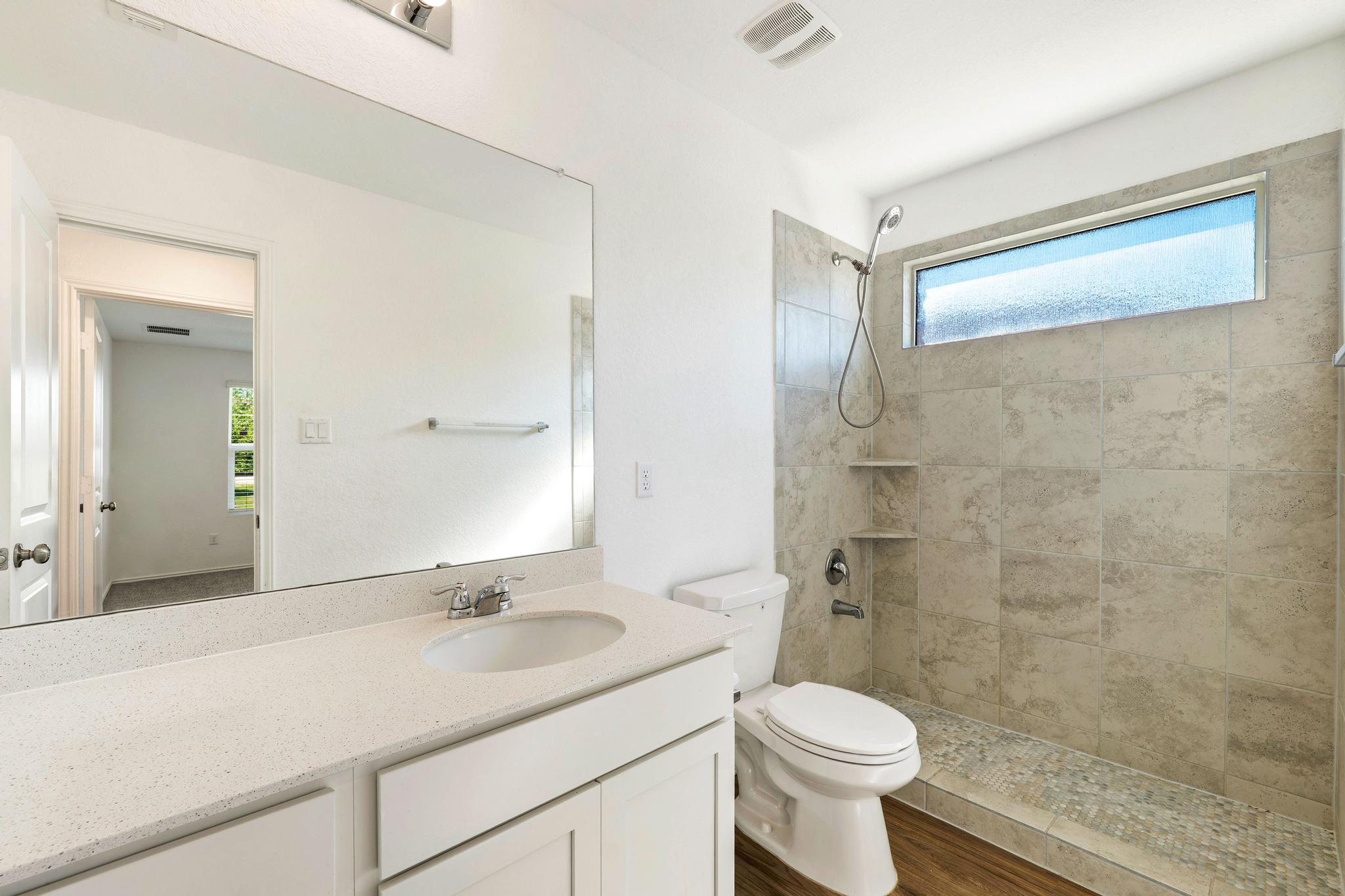133 Konik Road Georgetown, TX 78626 - Photo 20 of 29 a bathroom with a sink toilet and shower