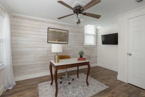 a workspace with furniture and a window