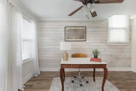 a view of a workspace with furniture