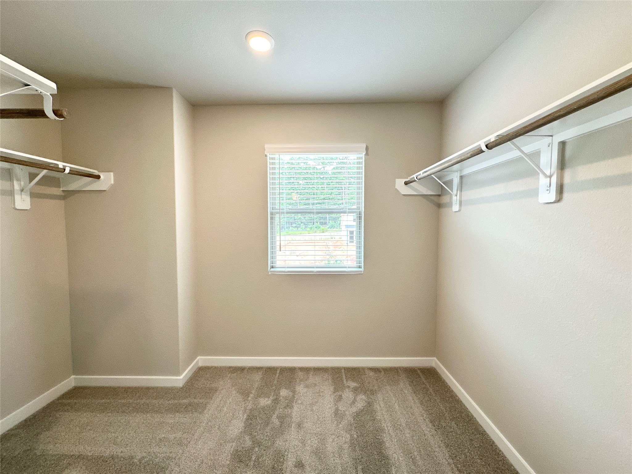 12198 Ridge Top Drive Conroe, TX 77304 - Photo 12 of 27 a view of a room with wooden floor and fan