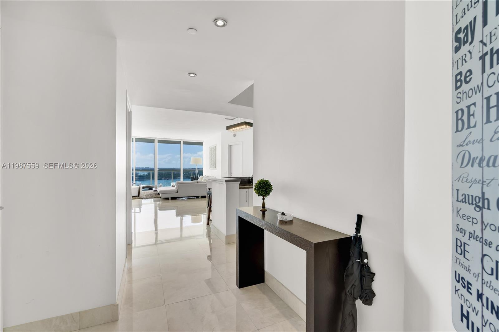 450 Alton Road, Unit 2005 Miami Beach, FL 33139 - Photo 4 of 19 a living room with furniture and a table