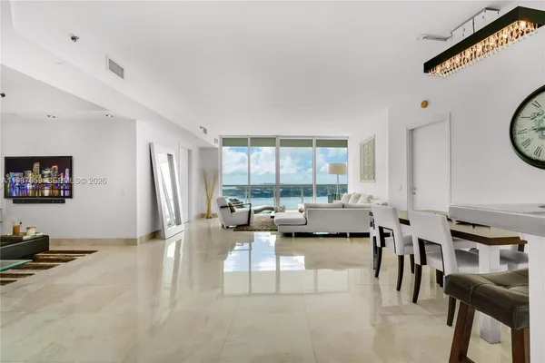 a view of a livingroom with furniture and window
