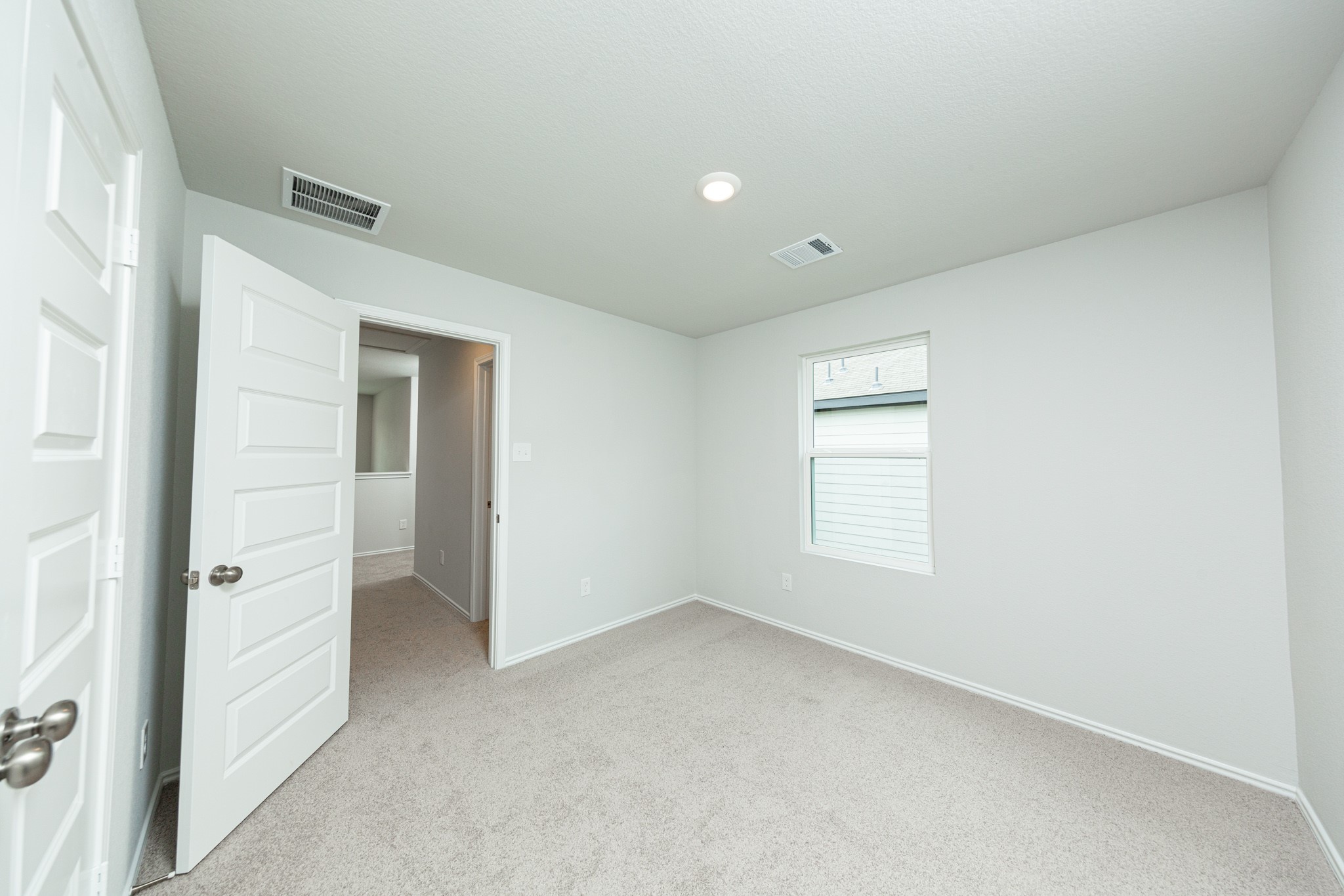 22759 American Kestrel Court Splendora, TX 77372 - Photo 13 of 23 a view of an empty room with a window