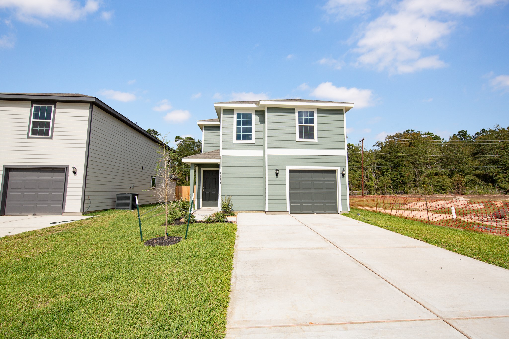 22759 American Kestrel Court Splendora, TX 77372 - Photo 2 of 23 a front view of house with yard and green space