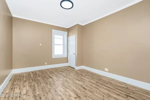 a view of an empty room and window