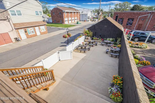 a view of roof deck with patio